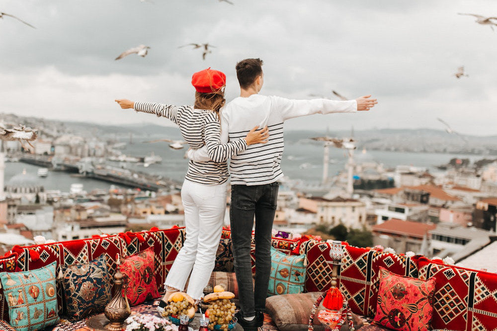 A couple wearing beautiful outfits looking over Istanbul