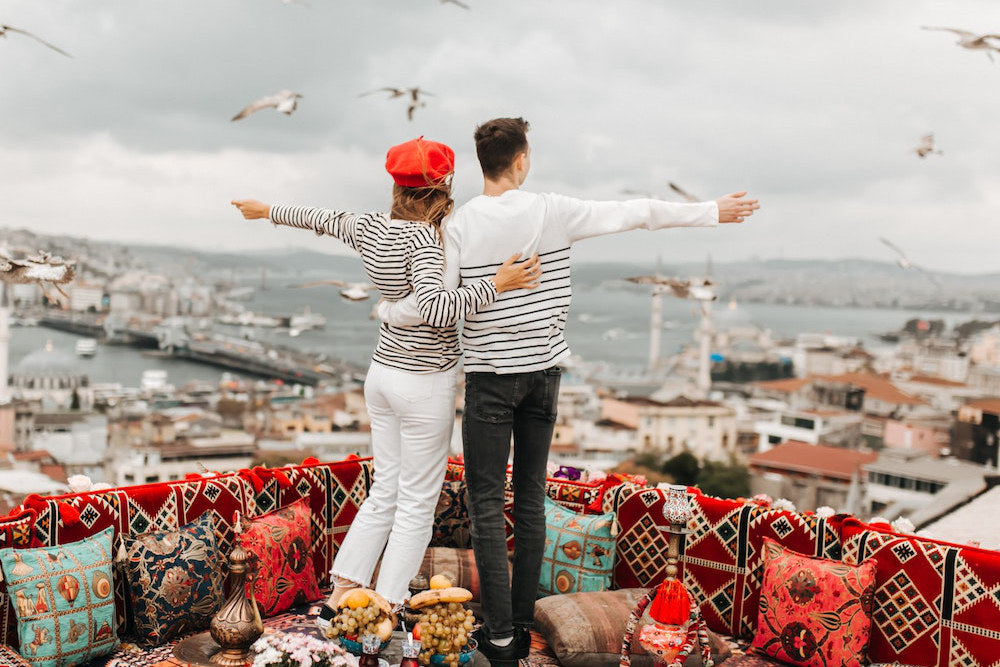 A couple wearing beautiful outfits looking over Istanbul
